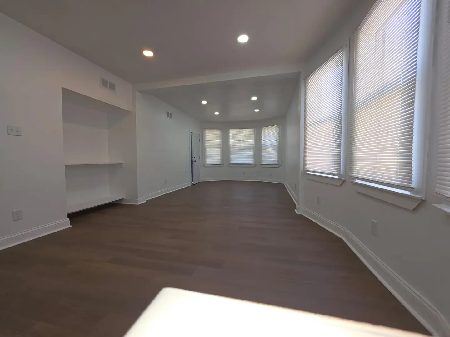 9250 Genessee Street — renovated living room with wide-plank flooring and recessed lighting in Detroit, Michigan